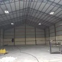 Finished metal building interior prepared for insulation